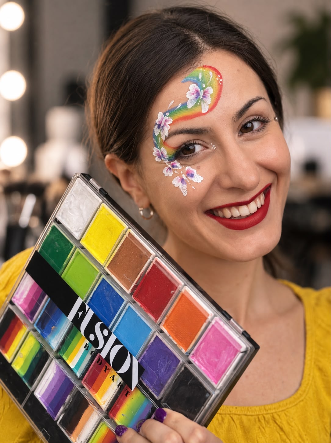 Isabella Goio con trucco arcobaleno e palette professionale Fusion